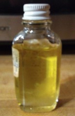 Vtg CUNNINGHAM Sweet Oil Emollient 1oz Glass Mini Glass Bottle 3/4 Full PROP TAG
