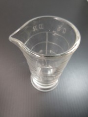 1930’s ENSIGN UK Footed Glass Embossed APOTHECARY MEASURE BEAKER Ounces & Drams