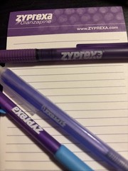 Zyprexa early 2000s collectible merch, 3 different pens, level, and mug