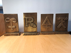 Lot of 4-Vintage Tinactin Secundum Artem 1976, ’79, ’80 & ’81 Brass Paperweight