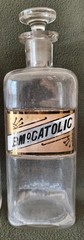 A LOT OF FOUR WT&CO CLEAR GLASS PHARMACY BOTTLES.GLASS LABELS