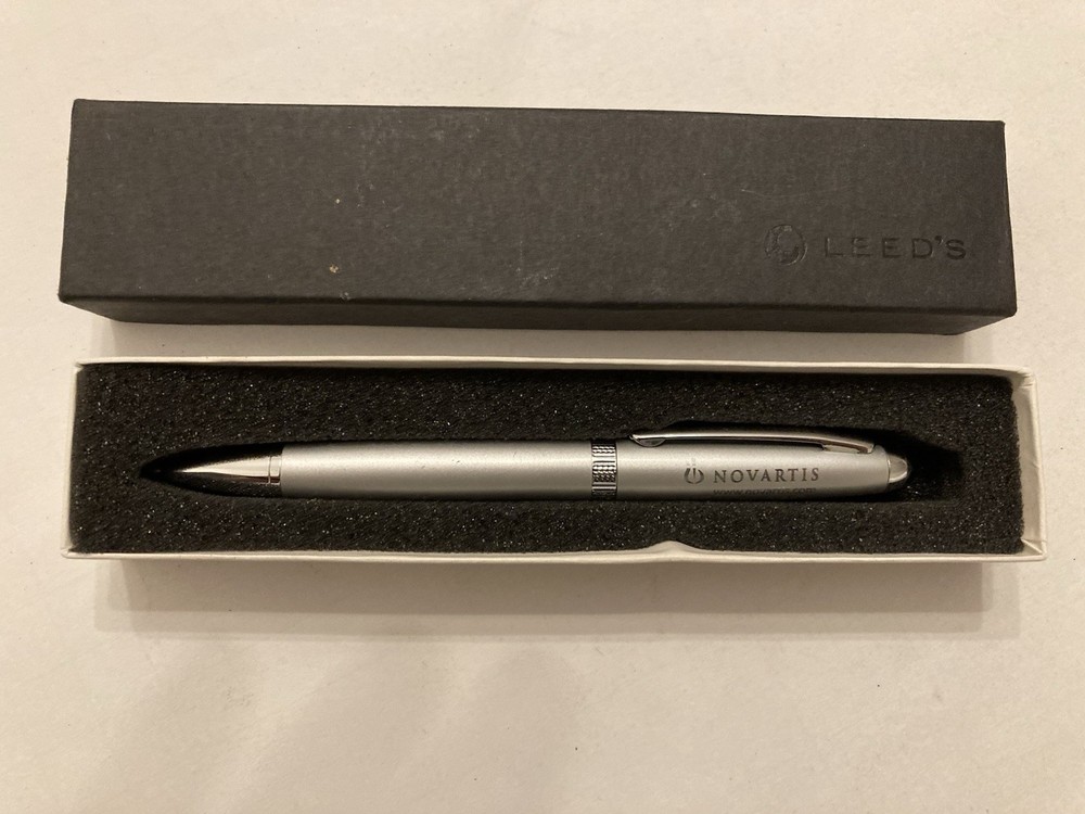 Leed’s Novartis Pharmaceutical Promo Pen NIB Silver Needs Ink Advertising Logo
