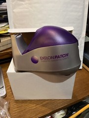 ONE EXELON PATCH DRUG REP PROMO HEAVY WEIGHTED TAPE DISPENSER