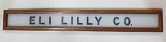 Vintage Eli Lilly Co. Milk White Glass Sign in Frame 6 3/4″ x 4 3/4″ GS00329