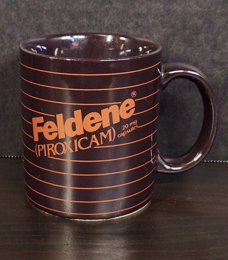 Vintage Feldene Piroxicam 20mg Pharmaceutical Advertising Coffee Mug Brown Promo