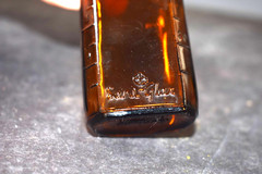Vintage Medicine Bottle, Amber Glass, Sani-Glass with Black Lid, 4″ Tall
