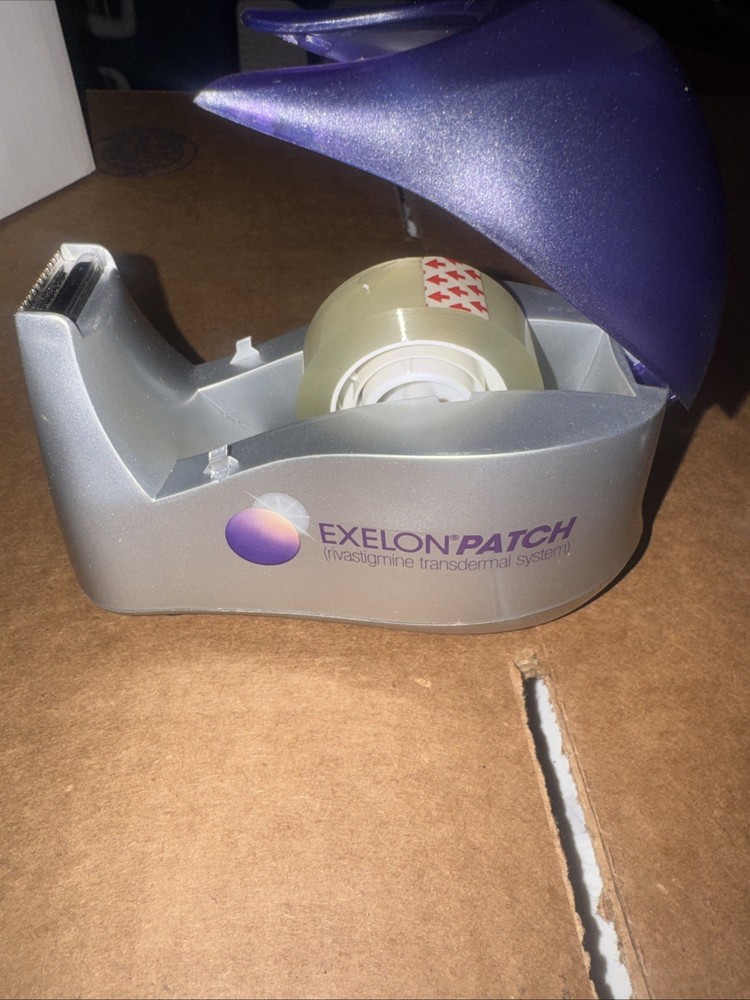 ONE EXELON PATCH DRUG REP PROMO HEAVY WEIGHTED TAPE DISPENSER