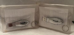 VTG LOT OF 2 NAMENDA USB FLASH MEMORY DEVICES + KEYRINGS PHARMA REP LOGO NEW