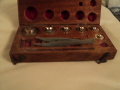 ANTIQUE BRASS JEWELLER WEIGHTS IN ORIGINAL WOODEN CASE MISSING FEW OF THEM