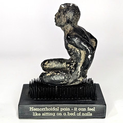 Vintage Proctofoam Pharmaceutical Advertising Bed Of Nails Fakir Figure