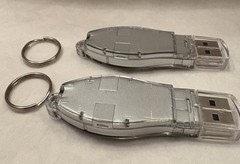 VTG LOT OF 2 NAMENDA USB FLASH MEMORY DEVICES + KEYRINGS PHARMA REP LOGO NEW