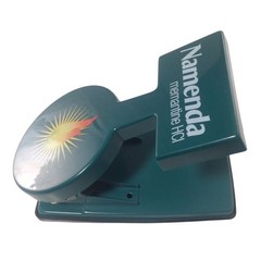 Namenda Memantine HCl Pharma Promo 2-Hole Punch Teal Green Sunburst Logo Vintage