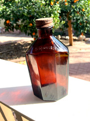 BEAUTIFUL Antique Amber Squibb embossed Glass Drug or Pharmacy Jar, 7“ Tall