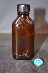 Vintage Medicine Bottle, Amber Glass, Sani-Glass with Black Lid, 4″ Tall