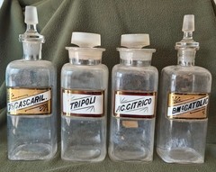 A LOT OF FOUR WT&CO CLEAR GLASS PHARMACY BOTTLES.GLASS LABELS