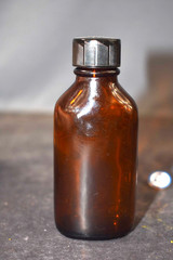 Vintage Medicine Bottle, Amber Glass, Sani-Glass with Black Lid, 4″ Tall