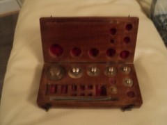 ANTIQUE BRASS JEWELLER WEIGHTS IN ORIGINAL WOODEN CASE MISSING FEW OF THEM