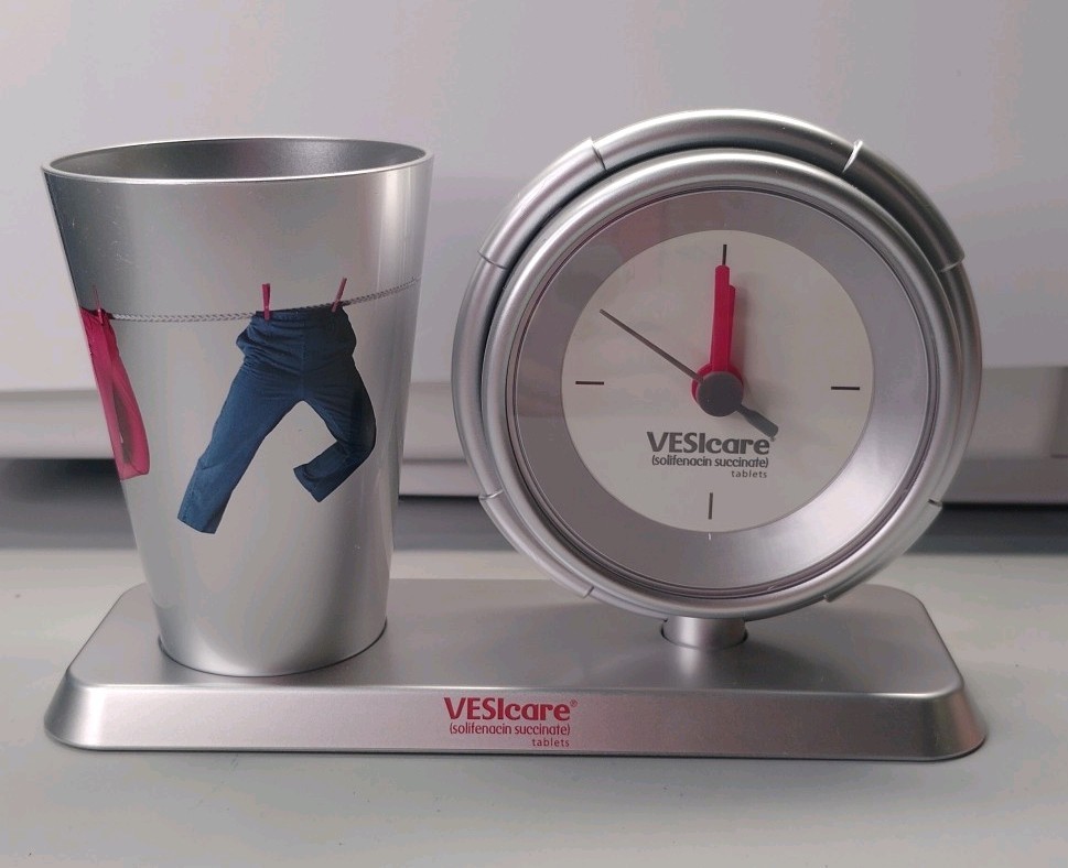 Pharmaceutical Promo VESIcare Desktop Plastic 4.5″H Battery Clock & Pen Holder