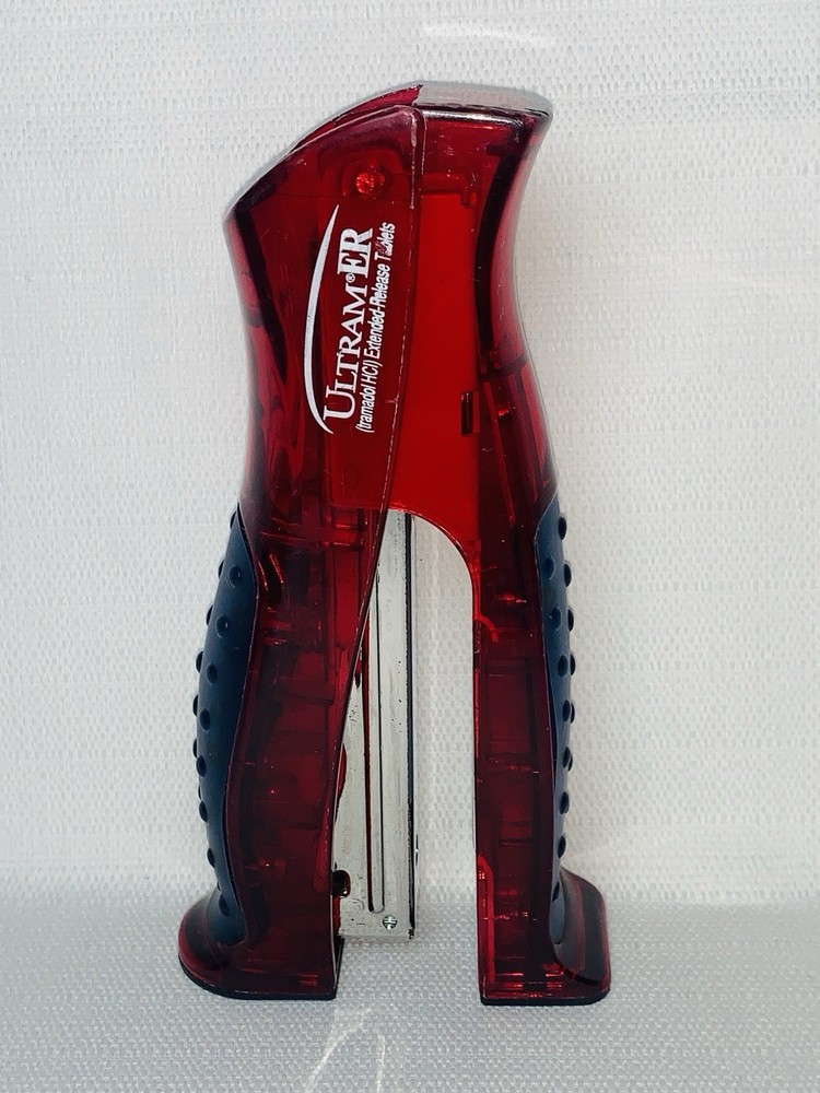 Ultram ER Drug Rep Promo Stapler – Red Translucent Stand-Up Ergonomic Squeeze