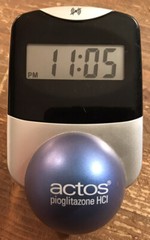 Actos Pharmaceutical Drug Rep Clock Alarm Date Balances On Ball