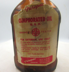 1940’s Purepac Caphorated Oil New York 3 5/8 inch tall Amber Medicine Bottle