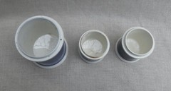 Collection of Small Blue Slip-Decorated Ceramic Apothecary Jars with Lids