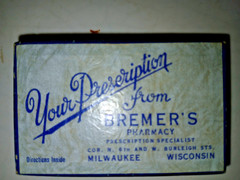 PILL BOX FROM BREMERS PHARMACY MILWAUKE VINTAGE 2 3/4 X1/3/4 X1/2″