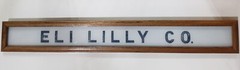 Vintage Eli Lilly Co. Milk White Glass Sign in Frame 6 3/4″ x 4 3/4″ GS00329