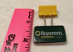 VINTAGE ROZEREM GREEN/YELLOW BINDER CLIP PHARMACEUTICAL DRUG REP LOGO NEW