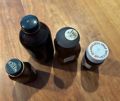 4 glass medicine bottles, Thyroid, Iodin ration, Pyridium Tri-Sulfa, Toryn Syrup
