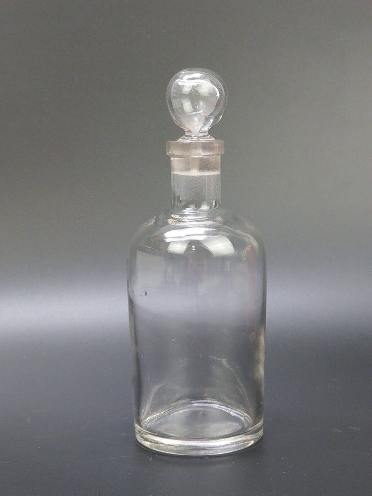 Antique clear medicine bottle with stopper medium size