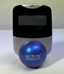Actos Pharmaceutical Drug Rep Clock Balances On Ball, Works