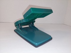 Namenda Pharmaceutical Drug Rep Green Two Hole Paper Punch Plastic Advertising