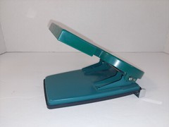 Namenda Pharmaceutical Drug Rep Green Two Hole Paper Punch Plastic Advertising