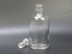 Antique clear medicine bottle with stopper medium size