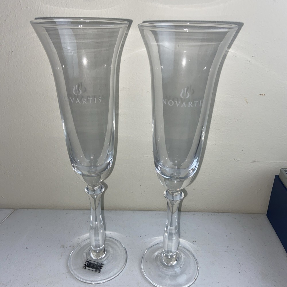 NOVARTIS Champagne Glasses Set Of 2 Clear Crystal 10” Tall Pharmacy Medical NOS