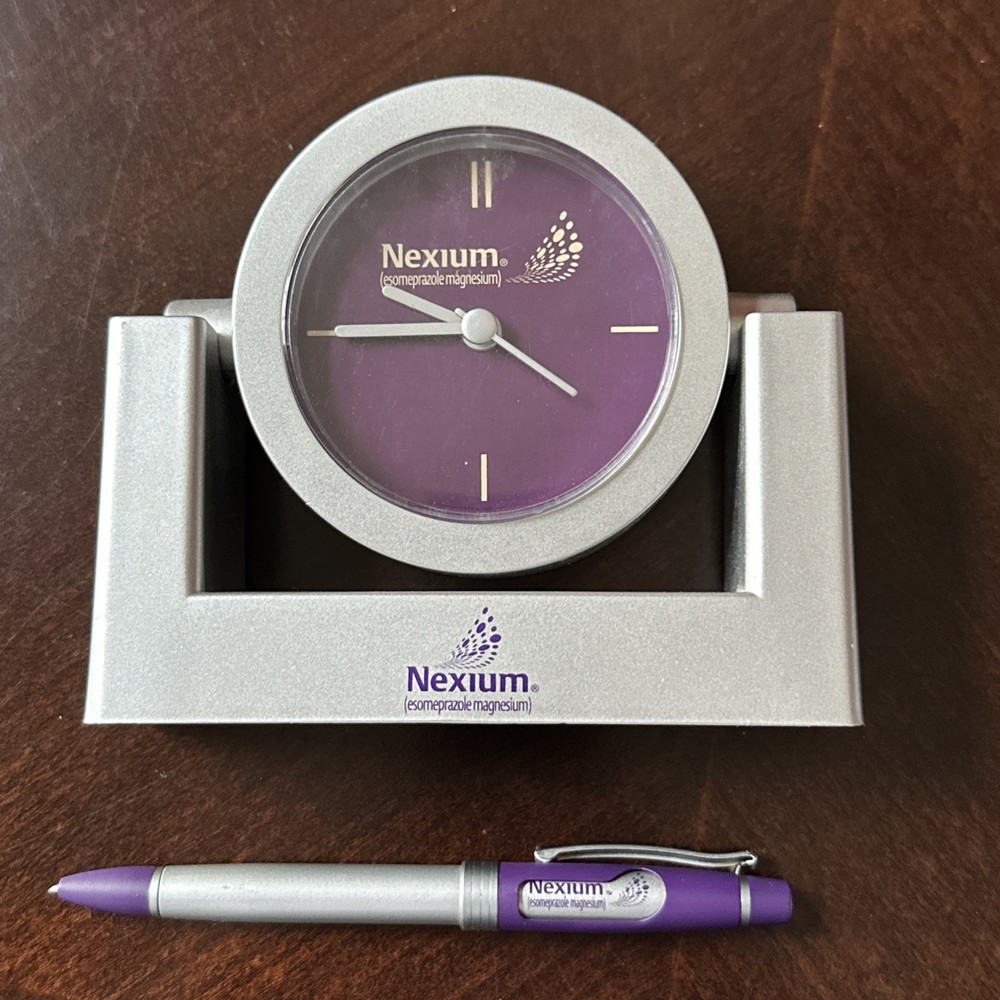 Nexium collectible silver purple clock and pen