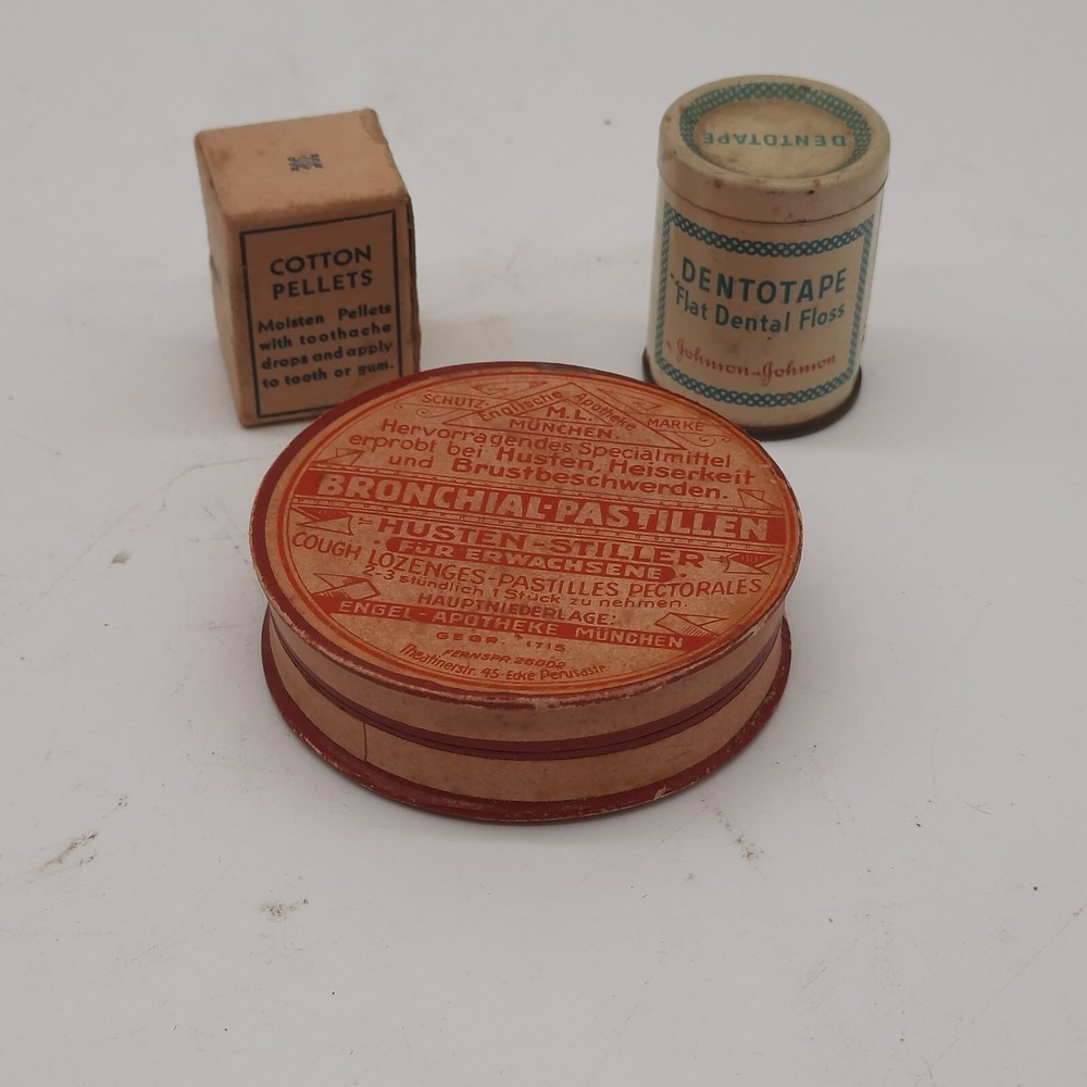 Vintage medicine cabinet packaging, cotton pellets, floss, lozenges, paper, meta