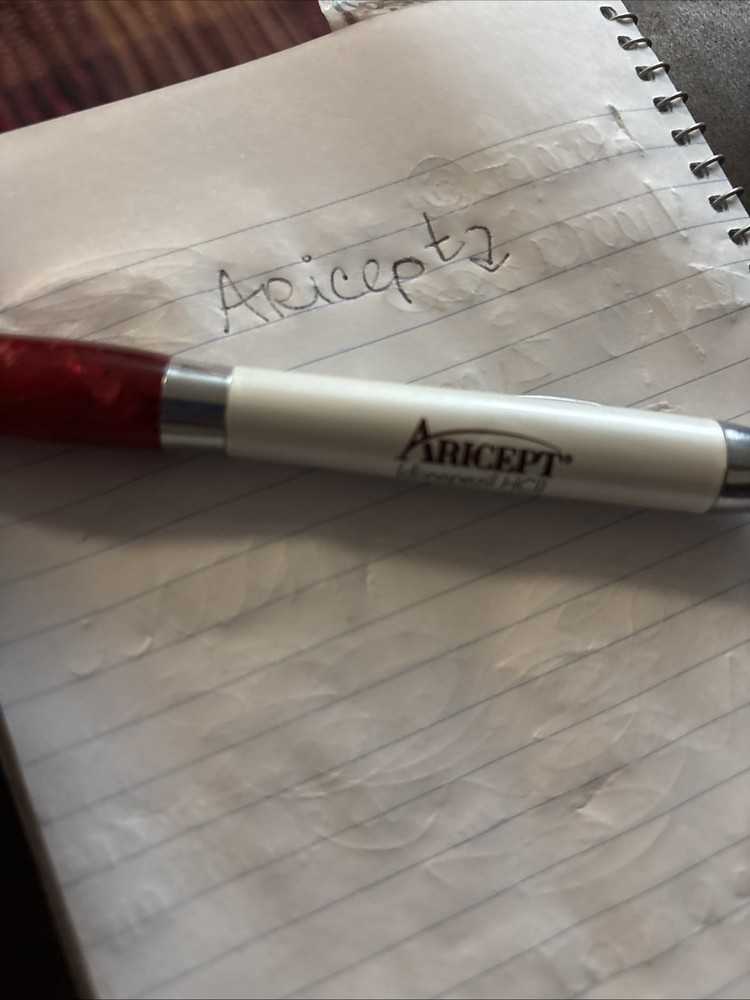 Metal and Plastic Aricept pharmaceutical rep pen. writes, but not well