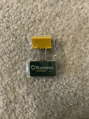VINTAGE ROZEREM GREEN/YELLOW BINDER CLIP PHARMACEUTICAL DRUG REP LOGO NEW
