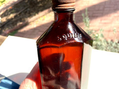 BEAUTIFUL Antique Amber Squibb embossed Glass Drug or Pharmacy Jar, 7“ Tall