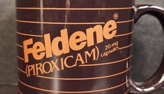 Vintage Feldene Piroxicam 20mg Pharmaceutical Advertising Coffee Mug Brown Promo