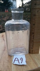 VINTAGE TARRANT CO CHEMISTS CLEAR GLASS CORK TOP APOTHECARY BOTTLE