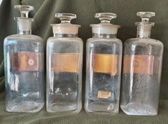 A LOT OF FOUR WT&CO CLEAR GLASS PHARMACY BOTTLES.GLASS LABELS