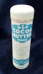 Old Advertising Medicine Tin USP Pure Cocoa Butter Woltra Co NY Push Dispenser