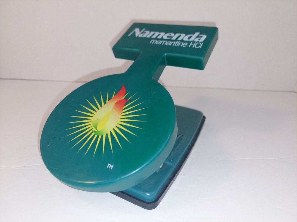 Namenda Pharmaceutical Drug Rep Green Two Hole Paper Punch Plastic Advertising