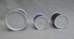 Collection of Small Blue Slip-Decorated Ceramic Apothecary Jars with Lids