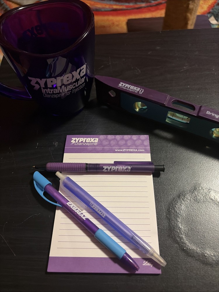 Zyprexa early 2000s collectible merch, 3 different pens, level, and mug