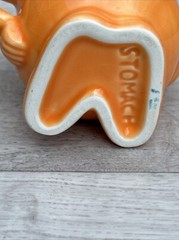 Actos Anthropomorphic Ceramic Mug Pharmaceutical Medical Stomach orange