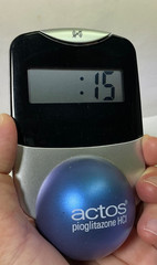 Actos Pharmaceutical Drug Rep Clock Balances On Ball, Works